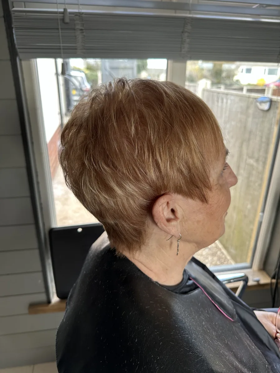 Warm copper pixie cut with soft, textured layers