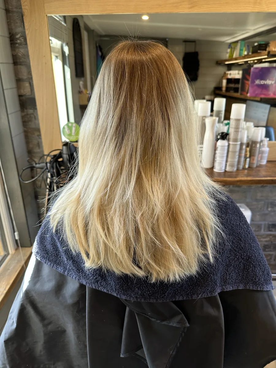 Before: blonde with dark roots blended to a soft, ash blonde with a smooth finish