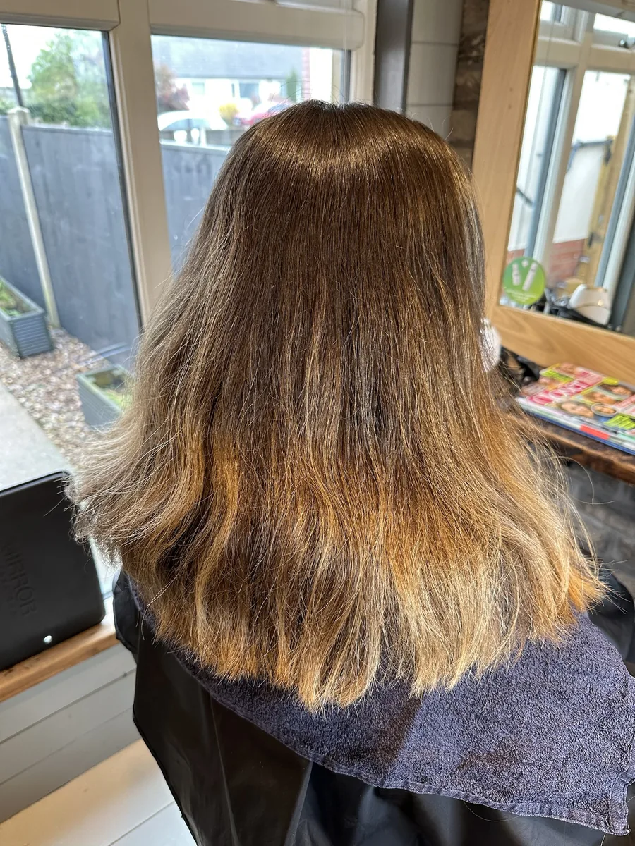 Before: warm brown ombré with orange ends refreshed to a blended colour with a flicked cut