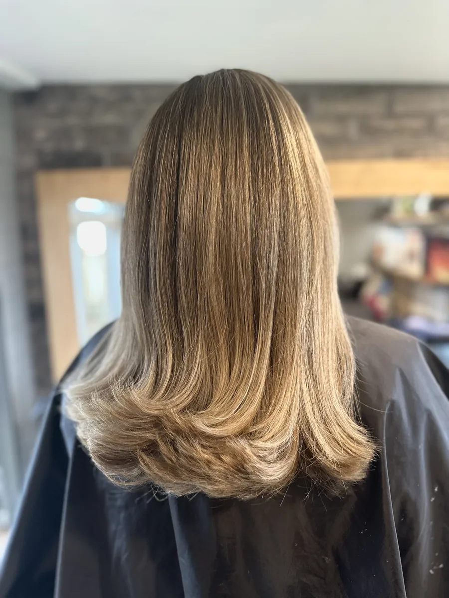After: warm brown ombré with orange ends refreshed to a blended colour with a flicked cut