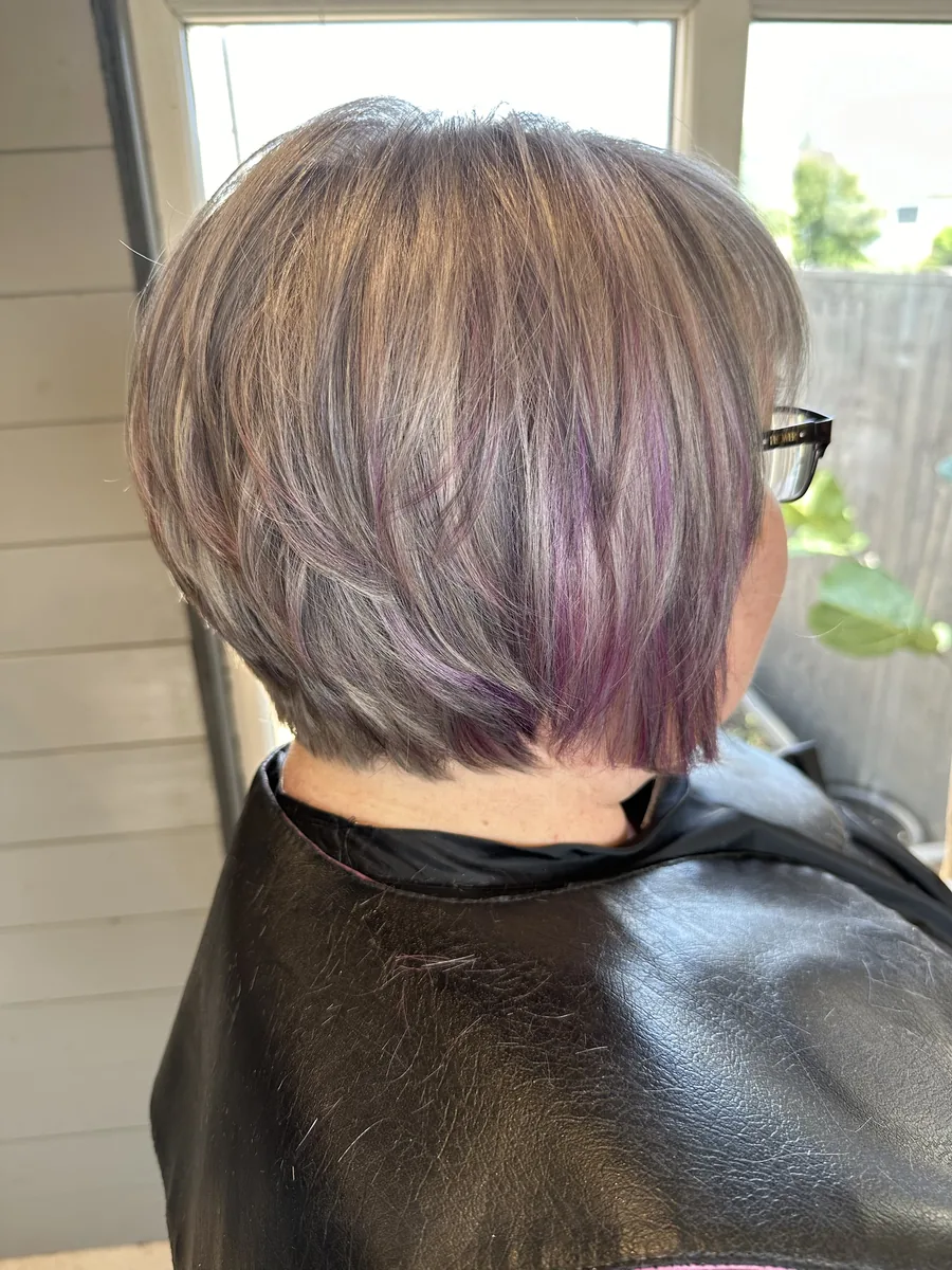 Short layered cut in soft silver and lilac tones