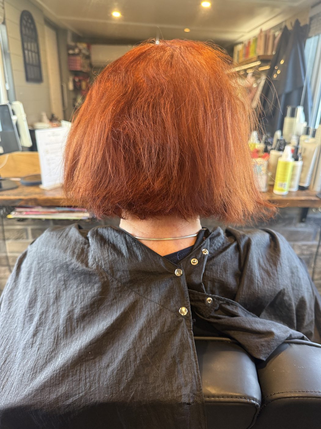 Before: faded copper refreshed to a rich red, with a sharp, polished bob