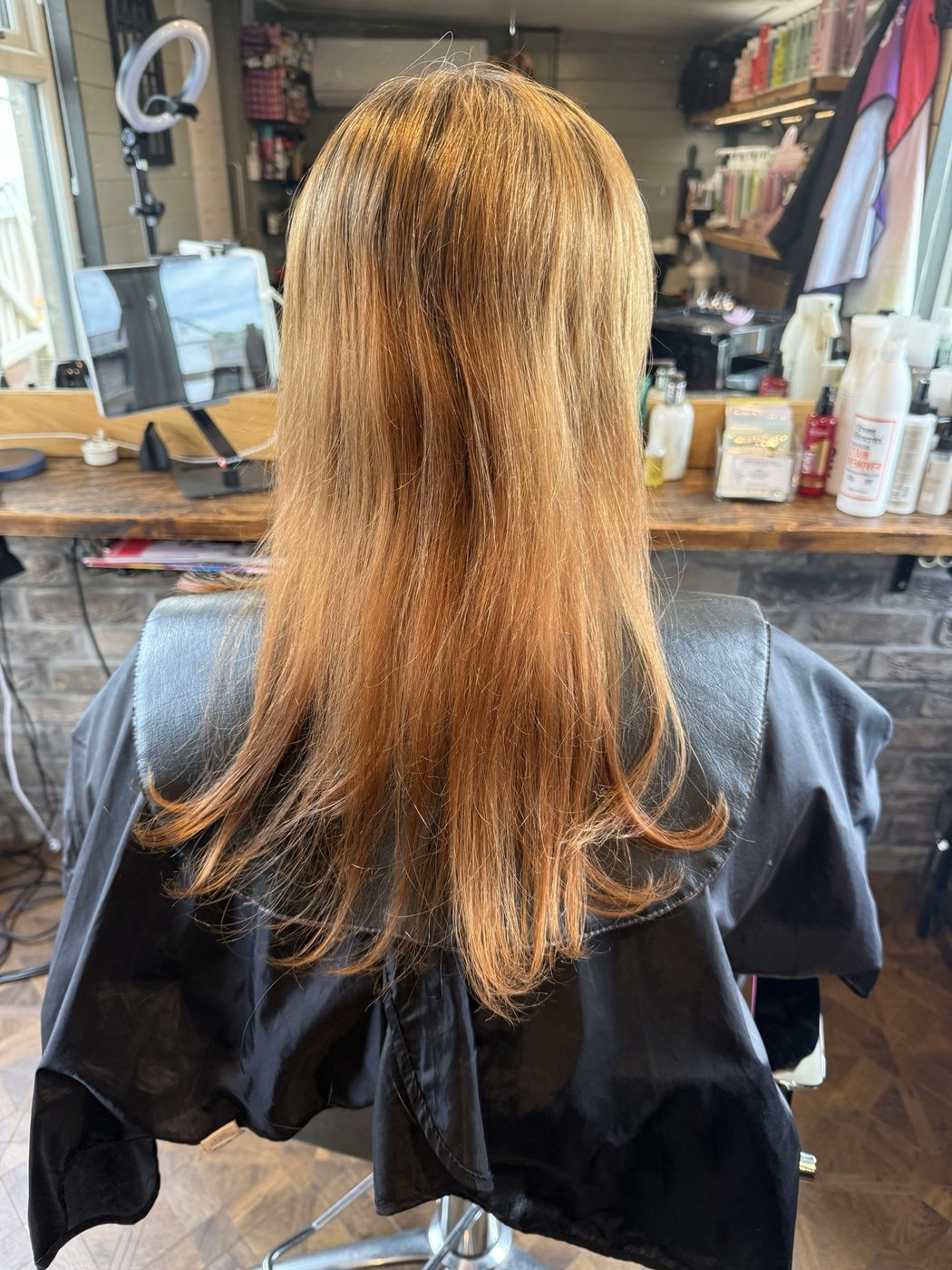 Before: orange-toned hair corrected to a cool, blended blonde