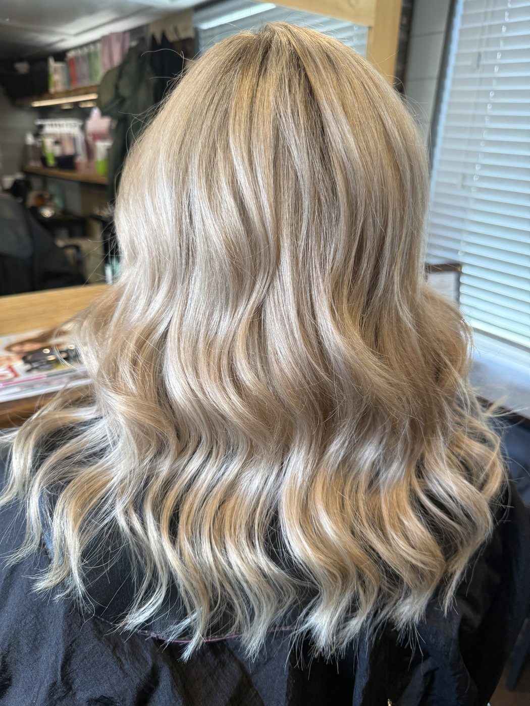 After: warm, grown-out blonde refreshed to an icy, lived-in blonde